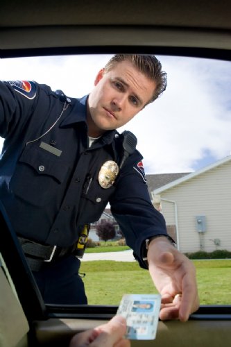 thumbnail of police offer receiving drivers license from a possible PWS