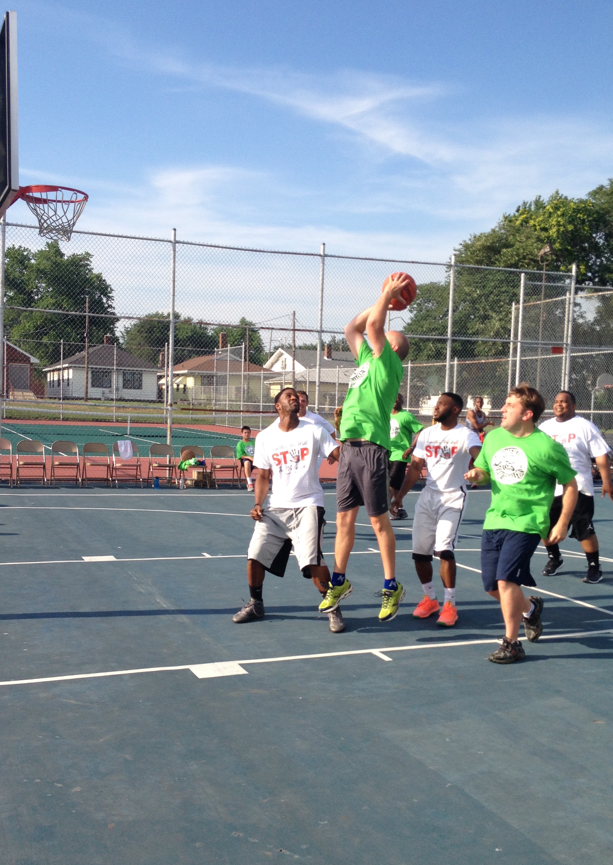 Photos are Evansville Officers and Prosecutor joining the community dust bowl Basket Ball 