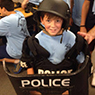 photo of child wearing police equipment