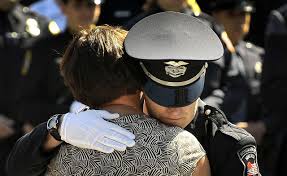 photo of female officer consoling a woman