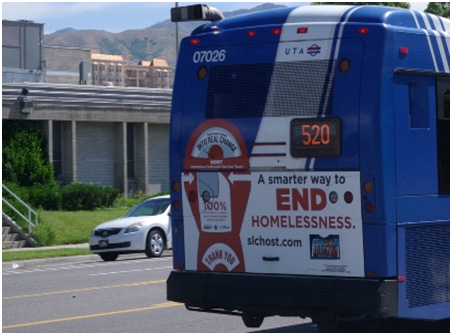 photo of bus with a smarter way to END homelessness sticker