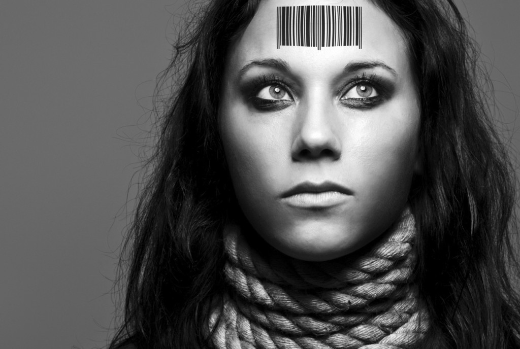 photo of a woman with a barcode on her forehead