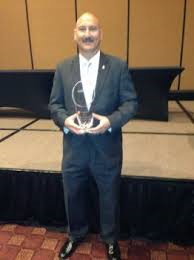 Galveston Chief of Police Henry S. Porretto accepts the Innovations in Human Resources Management award