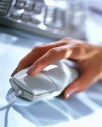 image of woman's hand holding a computer mouse