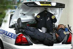 image of Police Officer getting sleep in his cruiser