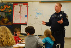 A School Resource Officer speaking to students