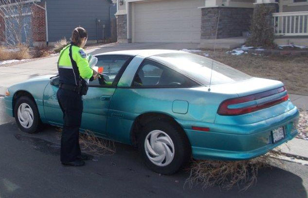 photo of colorado springs officer inspecting car 3