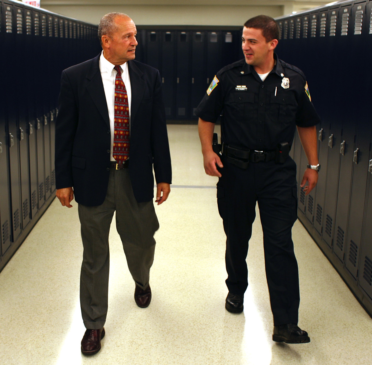 photo of SRO and Principal walking down a hall