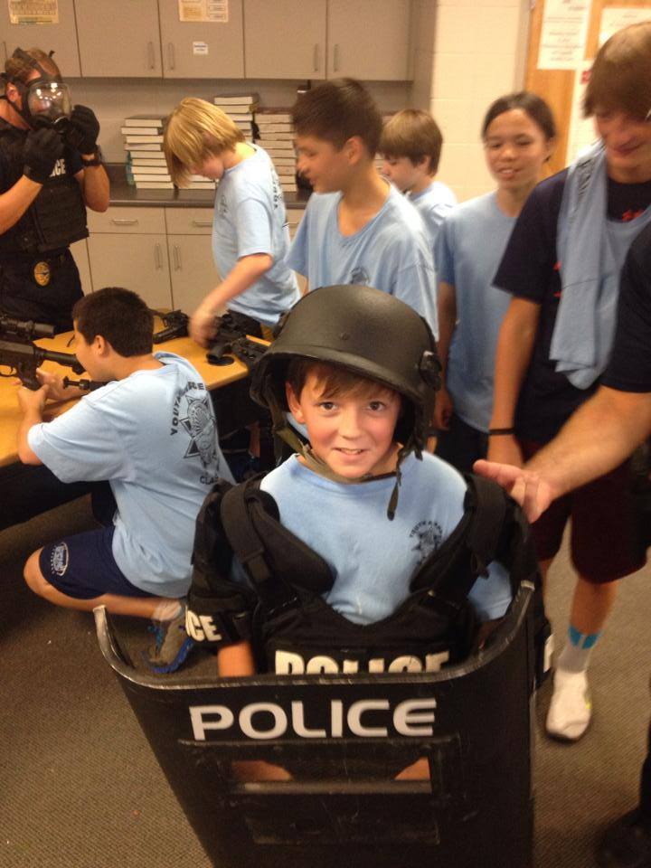 photo of child wearing police equipment