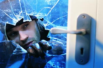 photo of male breaking in a house