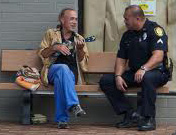 photo of police officer talking with a community resident