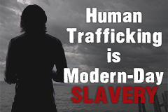 photo of sign that says human trafficking is modern-day slavery