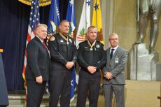 Award Recipients Officers Curt Vajgrt (L) and Andy Dobbins (R) stand for a photograph with their Captain Dave Disney (Left) and Chief Ross McCarty (Right)
